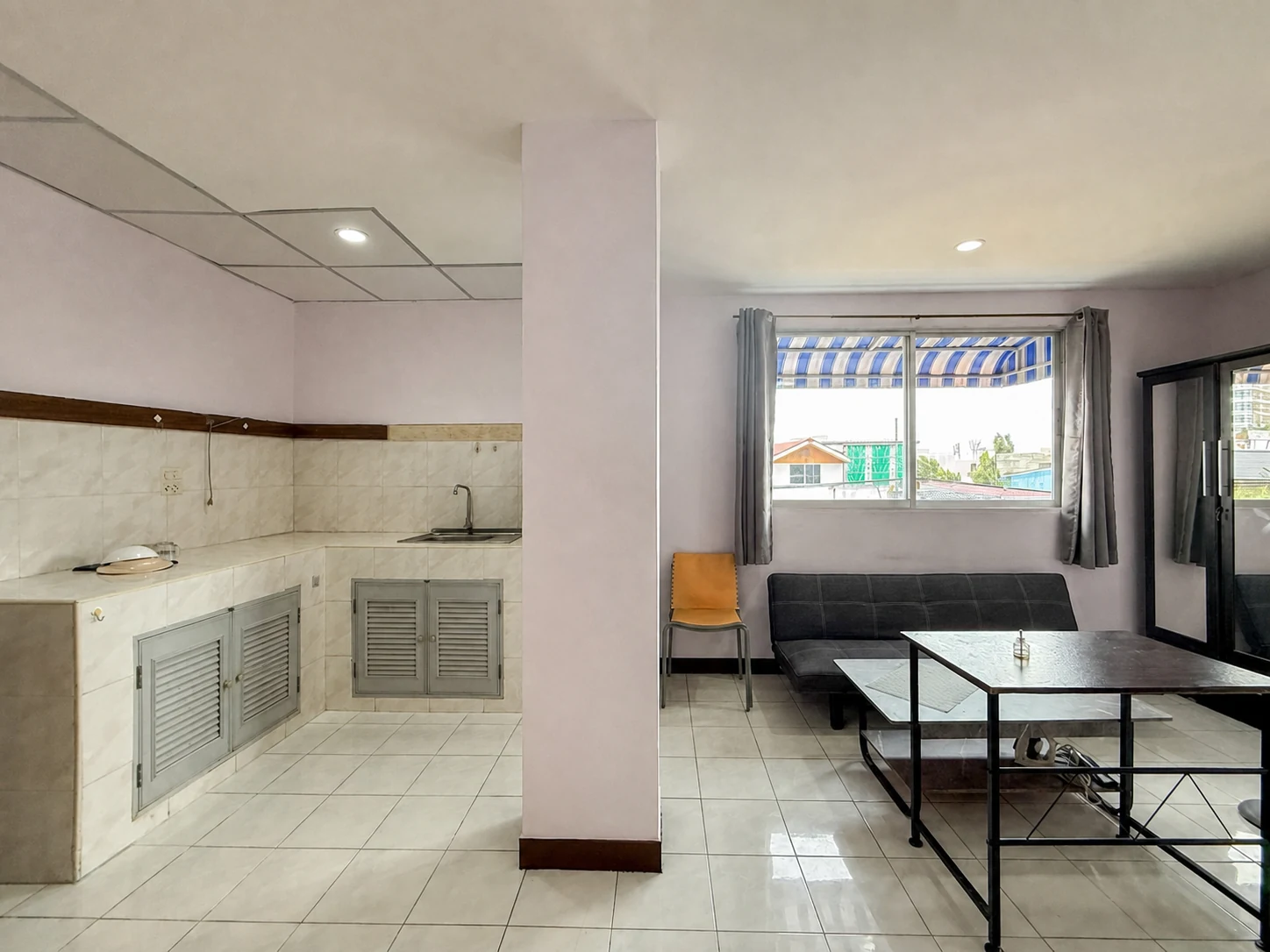 Example room with living area and simple kitchen counter